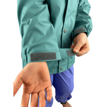 Adjustable cuff on kids waterproof jacket with mud guard, secure fit for outdoor play