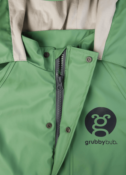 Close up image of a sage green waterproof rain suit showing zip, neck closure and hood