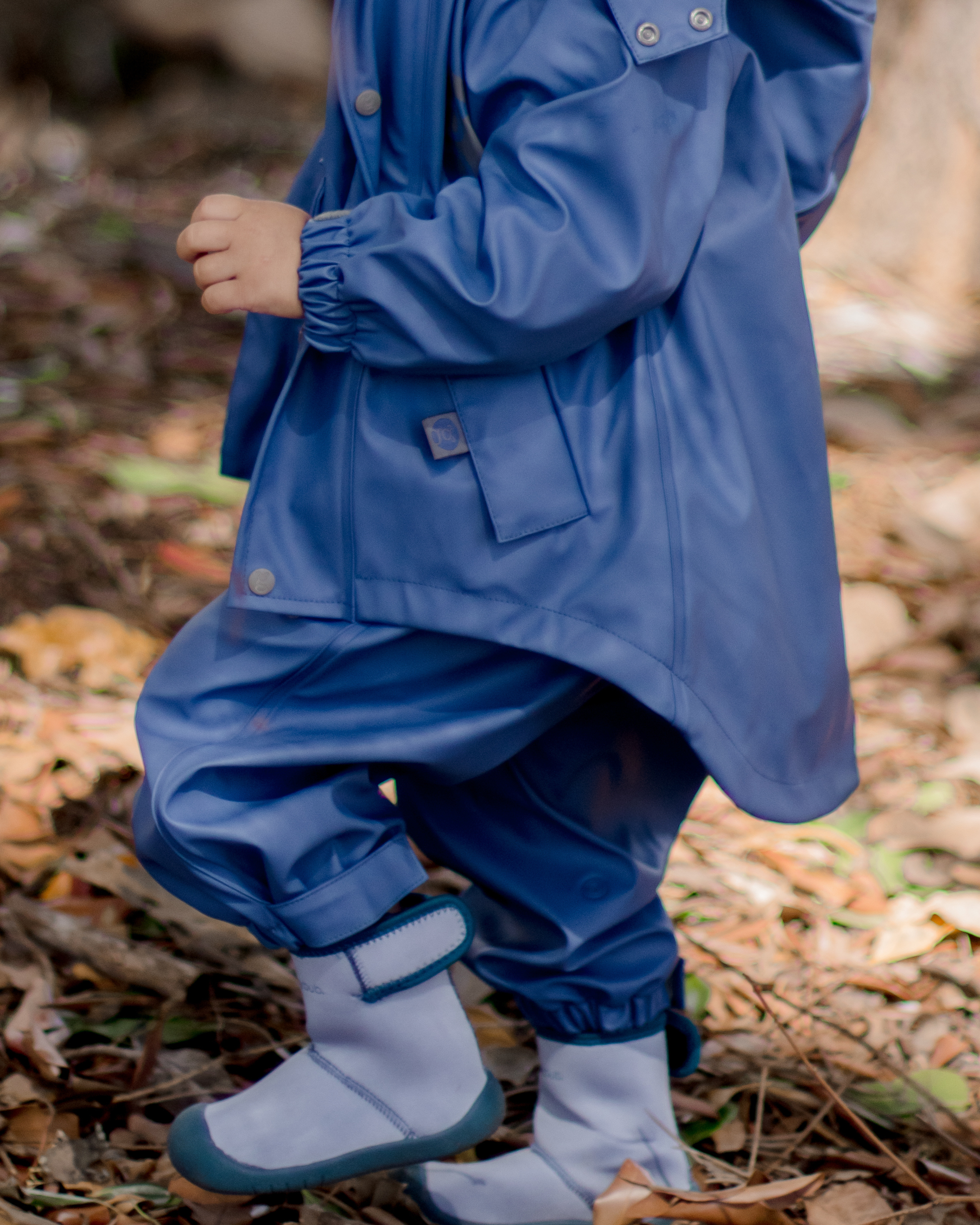 Kids waterproof jacket with mud guard and soft sole boots, durable outdoor play clothing for toddlers