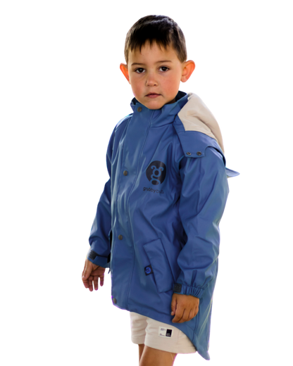 Kids blue waterproof jacket with mud guard and extended back hem, outdoor play rainwear